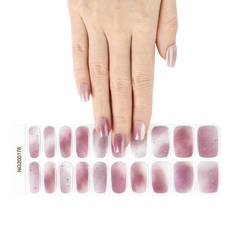 Set of sheer mauve and white gradient semi-cured gel nail polish strips with a hand model displaying the colour.