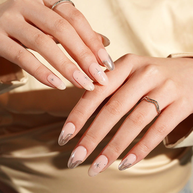 Close-up of hands with stylish nail design on a neutral background