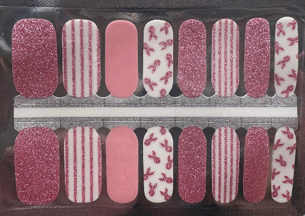 Set of pink and white nail art stickers in a clear plastic packaging.