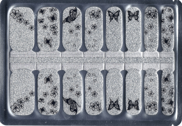 Nail art stickers with butterflies and floral designs on a clear background