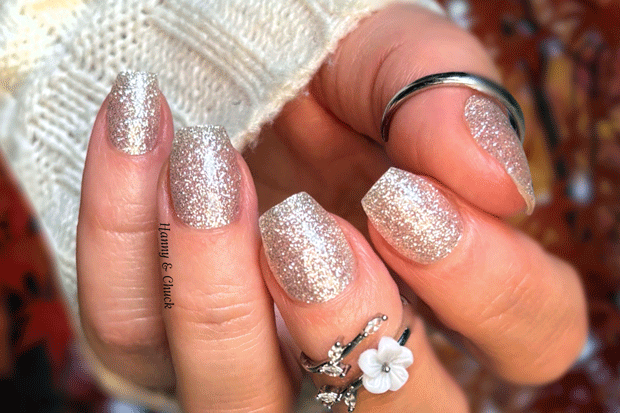 White glitter nail polish wraps on nails.