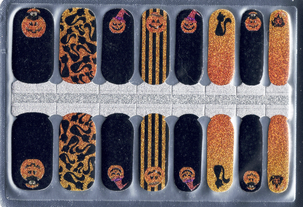 Set of Halloween-themed nail wraps in a clear plastic case.