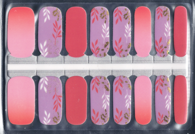 Set of 16 nail wraps with coral and lilac leaf designs in a clear plastic package.