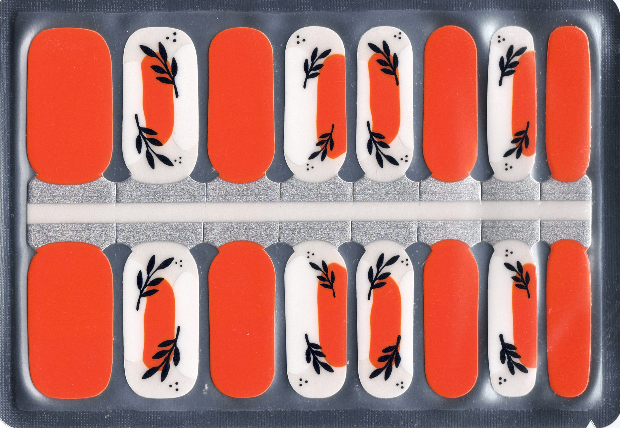 Packaging of 16 orange and white nail polish strips with black leaf design 