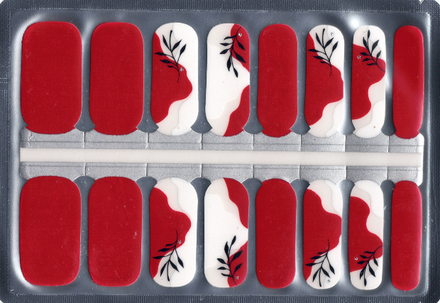 Set of red and white nail wraps with black leaf design in a clear packaging.