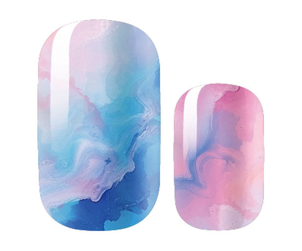 Two nail wraps, one larger and elongated and the other smaller and rounded, are displayed side-by-side on a white background.  Both wraps feature a marbled, watercolor-like design in pastel blue, pink, and white, with a glossy finish and subtle curvature suggesting a delicate and ethereal aesthetic.